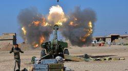 Popular Mobilization Forces (PMF) fires towards Islamic State militants during a battle with Islamic State militants, west of Mosul,Iraq February 22, 2017. REUTERS/Stringer