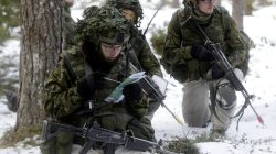 An Estonian army conscript soldiers attend a tactical training in the military training field near Tapa, Estonia February 16, 2017. REUTERS/Ints Kalnins