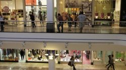 Shoppers walk in a mall in Refice, northeast Brazil, May 5, 2010. REUTERS/Bruno Domingos