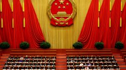 China's President Xi Jinping and other delegates listen as China's Premier Li Keqiang (not pictured) delivers a government work report during the opening session of the National People's Congress at the Great Hall of the People in Beijing. REUTERS/Damir Sagolj