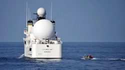 File photo: U.S. sailors in a rigid-hull inflatable boat approach the Military Sealift Command missile range instrumentation ship USNS Invincible (L) to conduct a personnel transfer in Arabian Sea on November 21, 2012. Courtesy Deven B. King/U.S. Navy/Handout via REUTERS