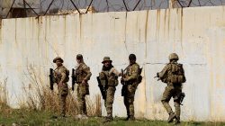 Iraqi rapid response members are seen as they try to avoid being hit by Islamic State snipers in western Mosul, Iraq March 9, 2017. REUTERS/Zohra Bensemra