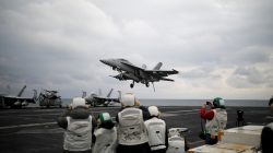 A U.S. F18 fighter jet lands on the deck of U.S. aircraft carrier USS Carl Vinson during an annual joint military exercise called "Foal Eagle" between South Korea and U.S., in the East Sea, South Korea, March 14, 2017. REUTERS/Kim Hong-Ji
