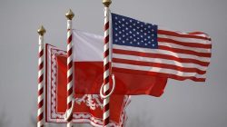 U.S. (R to L), Poland's flags and jack of the President of Poland are seen during the inauguration ceremony of bilateral military training between U.S. and Polish troops in Zagan, Poland,