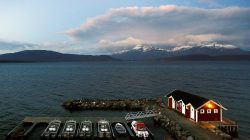 General view of a small harbour and snow-capped mountains in Bals-Fiord, north of the Arctic Circle, near the village of Mestervik in northern Norway.