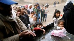 People queue to collect food rations at a food distribution center in Sanaa, Yemen March 21, 2017. REUTERS/Khaled Abdullah