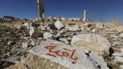 FILE PHOTO: Graffiti sprayed by Islamic State militants which reads "We remain" is seen on a stone at the Temple of Bel in the historic city of Palmyra, in Homs Governorate, Syria April 1, 2016. REUTERS/Omar Sanadik/File Photo