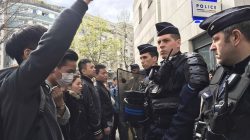 French police face off with members of the Chinese community during a protest demonstration outside a police station in Paris, France, March 28, 2017, after a Chinese man was shot dead by police at his Paris home on Sunday, triggering riots in the French capital by members of the Chinese community and a diplomatic protest by Beijing. REUTERS/Noemie Olive