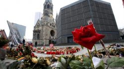 Flowers and candles are pictured at the site where on December 19, 2016 a truck ploughed through a crowd at a Christmas market on Breitscheidplatz square near Kurfuerstendamm avenue in Berlin, Germany, January 19, 2017. REUTERS/Fabrizio Bensch