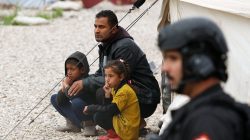Displaced Iraqi sit outside their tent during the visit of United Nations Secretary General Antonio Guterres at Hasansham camp, in Khazer, Iraq March 31, 2017. REUTERS/Suhaib Salem