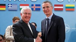 U.S. Secretary of State Rex Tillerson shakes hands with NATO Secretary General Jens Stoltenberg. REUTERS/Yves Herman