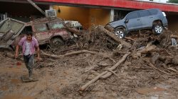 A man walks among the ruins after flooding and mudslides, caused by heavy rains leading several rivers to overflow, pushing sediment and rocks into buildings and roads, in Mocoa, Colombia