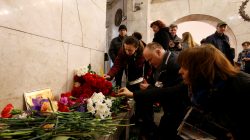 People leave candles in memory of victims of a blast in St.Petersburg metro, at Tekhnologicheskiy institut metro station in St. Petersburg, Russia, April 4, 2017. REUTERS/Grigory Dukor