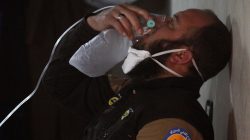 A civil defence member breathes through an oxygen mask, after what rescue workers described as a suspected gas attack in the town of Khan Sheikhoun in rebel-held Idlib, Syria April 4, 2017. REUTERS/Ammar Abdullah
