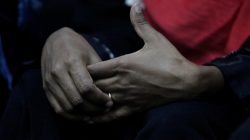 FILE PHOTO: An Eritrean migrant touches a ring on her hand at a military building in Misrata, Libya, November 6, 2016. REUTERS/Ismail Zitouny