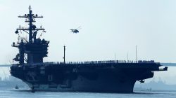 FILE PHOTO - Sailors man the rails of the USS Carl Vinson, a Nimitz-class aircraft carrier, as it departs its home port in San Diego, California August 22, 2014.