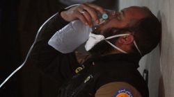A civil defence member breathes through an oxygen mask, after what rescue workers described as a suspected gas attack in the town of Khan Sheikhoun in rebel-held Idlib, Syria April 4, 2017.