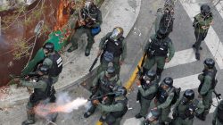 Riot police fire tear gas during a rally against Venezuela's President Nicolas Maduro's government in Caracas, Venezuela April 10, 2017. REUTERS/Christian Veron