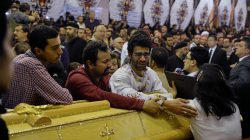 Relatives of victims react next to coffins arriving to the Coptic church that was bombed on Sunday in Tanta, Egypt, April 9, 2017. REUTERS/Mohamed Abd El Ghany