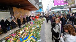 People lay flowers near the crime scene at Ahlens department store at the pedestrian street Drottninggatan in central Stockholm, Sweden, April 12, 2017. TT NEWS AGENCY/ Fredrik Sandberg via REUTERS