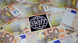 FILE PHOTO: Swift code bank logo is displayed on an iPhone 6s among Euro banknotes in this picture illustration January 26, 2016. REUTERS/Dado Ruvic/File Photo - RTS11WHG