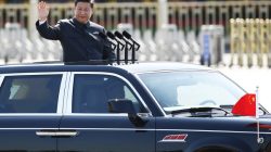 Chinese President Xi Jinping waves as he reviews the army, at the beginning of the military parade marking the 70th anniversary of the end of World War Two, in Beijing, China, September 3, 2015. REUTERS/Damir Sagolj