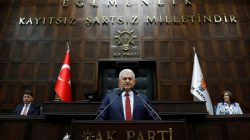 Turkey's Prime Minister Binali Yildirim addresses members of parliament from his ruling AK Party (AKP) during a meeting at the Turkish parliament in Ankara, Turkey, April 18, 2017. REUTERS/Umit Bektas