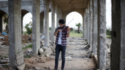 Ameen Mukdad, a violinist from Mosul who lived under ISIS's rule for two and a half years where they destroyed his musical instruments, performs in eastern Mosul, Iraq, April 19, 2017. REUTERS/ Muhammad Hamed