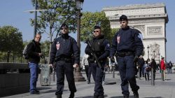 French CRS police patrol the Champs Elysees Avenue the day after a policeman was killed and two others were wounded in a shooting incident in Paris, France, April 21, 2017. REUTERS/Benoit Tessier
