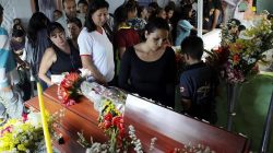 Mourners look at the coffin of Paola Ramirez, a student who died during a protest, in her wake in San Cristobal, Venezuela April 20, 2017. REUTERS/Carlos Eduardo Ramirez