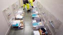 A municipal employee prepares ballot boxes on the eve of the first round of the French presidential election at a polling station in Tulle, France, April 22, 2017. REUTERS/Regis Duvignau