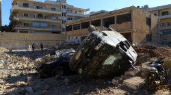 Damaged vehicles and hospital are pictured at a site hit by overnight airstrike, in Kafr Takharim, northwest of Idlib city, Syria April 25, 2017. REUTERS/Ammar Abdullah