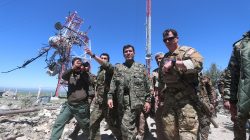 A U.S. military commander (R) walks with a commander (C) from the Kurdish People's Protection Units (YPG) as they inspect the damage at YPG headquarters after it was hit by Turkish airstrikes in Mount Karachok near Malikiya, Syria. REUTERS/ Rodi Said