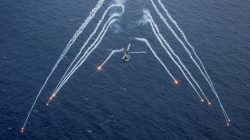 A U.S. Navy MH-60R Sea Hawk helicopter from the "Blue Hawks" of Helicopter Maritime Strike Squadron 78 fires chaff flares during a training exercise near the aircraft carrier USS Carl Vinson (CVN 70) in the Philippine Sea. U.S. Navy/Mass Communication Specialist 2nd Class Sean M. Castellano/via REUTERS