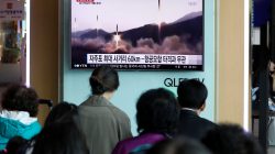 People watch a TV broadcasting of a news report on North Korea's missile launch, at a railway station in Seoul, South Korea. REUTERS/Kim Hong-Ji