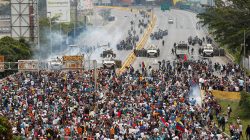 Opposition supporters clash with riot police during a rally against President Nicolas Maduro in Caracas, Venezuela, May 3, 2017. REUTERS/Christian Veron