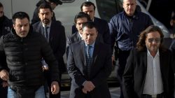 FILE PHOTO - Four of the eight Turkish soldiers (C), who fled to Greece in a helicopter and requested political asylum after a failed military coup against the government, line up as they are escorted by police officers at the Supreme Court in Athens, Greece, January 13, 2017. REUTERS/Alkis Konstantinidis/File Photo
