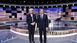 Candidates for the 2017 presidential election, Emmanuel Macron (R), head of the political movement En Marche !, or Onwards !, and Marine Le Pen, of the French National Front (FN) party, pose prior to the start of a live prime-time debate in the studios of French television station France 2, and French private station TF1 in La Plaine-Saint-Denis, near Paris. REUTERS/Eric Feferberg/Pool
