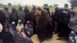 A group of 82 Chibok girls, who were held captive for three years by Islamist militants, wait to be released in exchange for several militant commanders, near Kumshe, Nigeria May 6, 2017. REUTERS/Zanah Mustapha