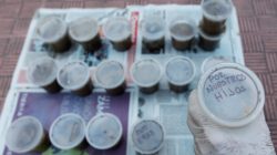 A woman holds a plastic pot filled with feces, called "Poopootovs", which is a play on Molotov cocktails, before they are thrown at security forces during protests, in addition to the usual rocks and petrol bombs, in Caracas, Venezuela May 9, 2017. The text reads, "For our children". REUTERS/Christian Veron