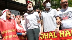 Nuriye Gulmen, a literature professor, and Semih Ozakca, a primary school teacher, who have been on hunger strike after they both lost their jobs in a crackdown following a failed July coup against President Tayyip Erdogan, take part in a protest against a government purge in Ankara, Turkey, May 11, 2017. REUTERS/Alp Eren Kaya
