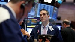 Traders work on the floor of the New York Stock Exchange (NYSE) in New York, U.S.,