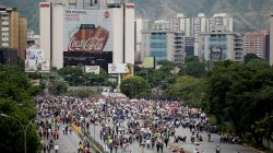 Opposition supporters block an avenue while rallying against President Nicolas Maduro in Caracas, Venezuela, May 15, 2017. REUTERS/Christian Veron