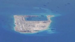 FILE PHOTO: Chinese dredging vessels are purportedly seen in the waters around Fiery Cross Reef in the disputed Spratly Islands in the South China Sea in this still image from video taken by a P-8A Poseidon surveillance aircraft provided by the United States Navy May 21, 2015. REUTERS/U.S. Navy/Handout via Reuters
