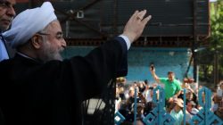 Iran's President Hassan Rouhani waves to supporters at a polling station during the presidential election in Tehran, Iran, May 19, 2017. President.ir/Handout via REUTERS