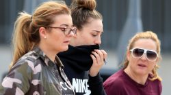 People walk out of a support centre at Manchester City's Etihad Stadium, Manchester, Britain, May 23, 2017. REUTERS/Jon Super