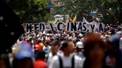 Demonstrators hold a banner that reads "MEDICINE RIGHT NOW" during a rally called by health care workers and opposition activists against Venezuela's President Nicolas Maduro in Caracas, Venezuela May 22, 2017. REUTERS/Carlos Barria