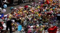 City council employees move flowers from the townhall in Albert Square to St Ann's Square in Manchester, Britain, May 24, 2017. REUTERS/Peter Nicholls