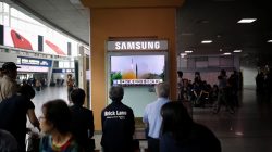 People watch a television broadcasting a news report on North Korea firing what appeared to be a short-range ballistic missile, at a railway station in Seoul, South Korea,