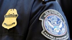 A U.S. Customs and Border Protection arm patch and badge